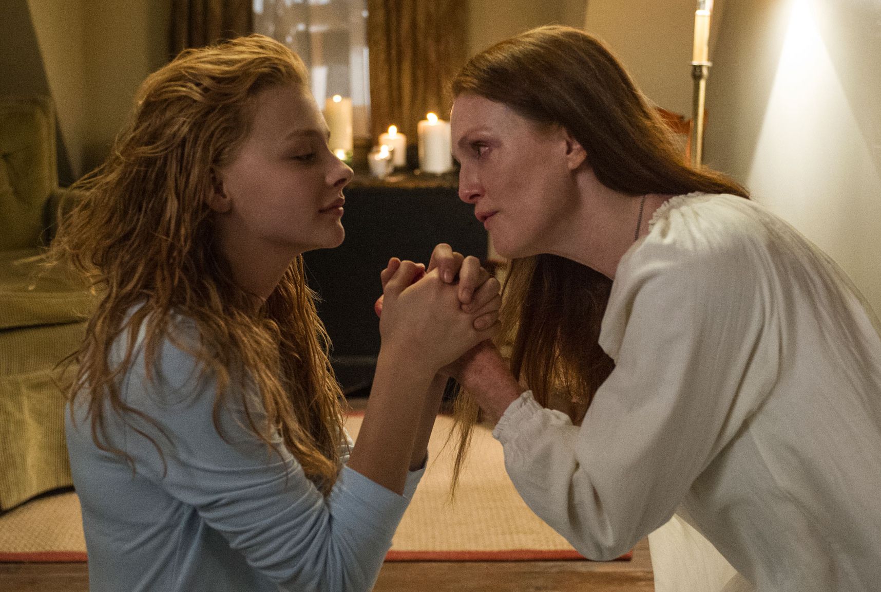 Julianne Moore and Chloe Grace Moretz pray