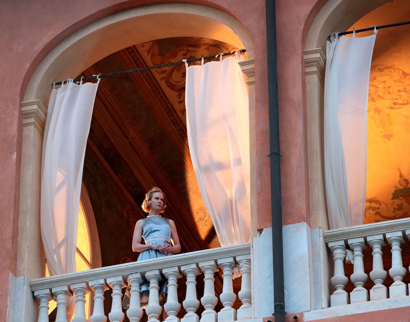 Grace Kelly looking from the balcony