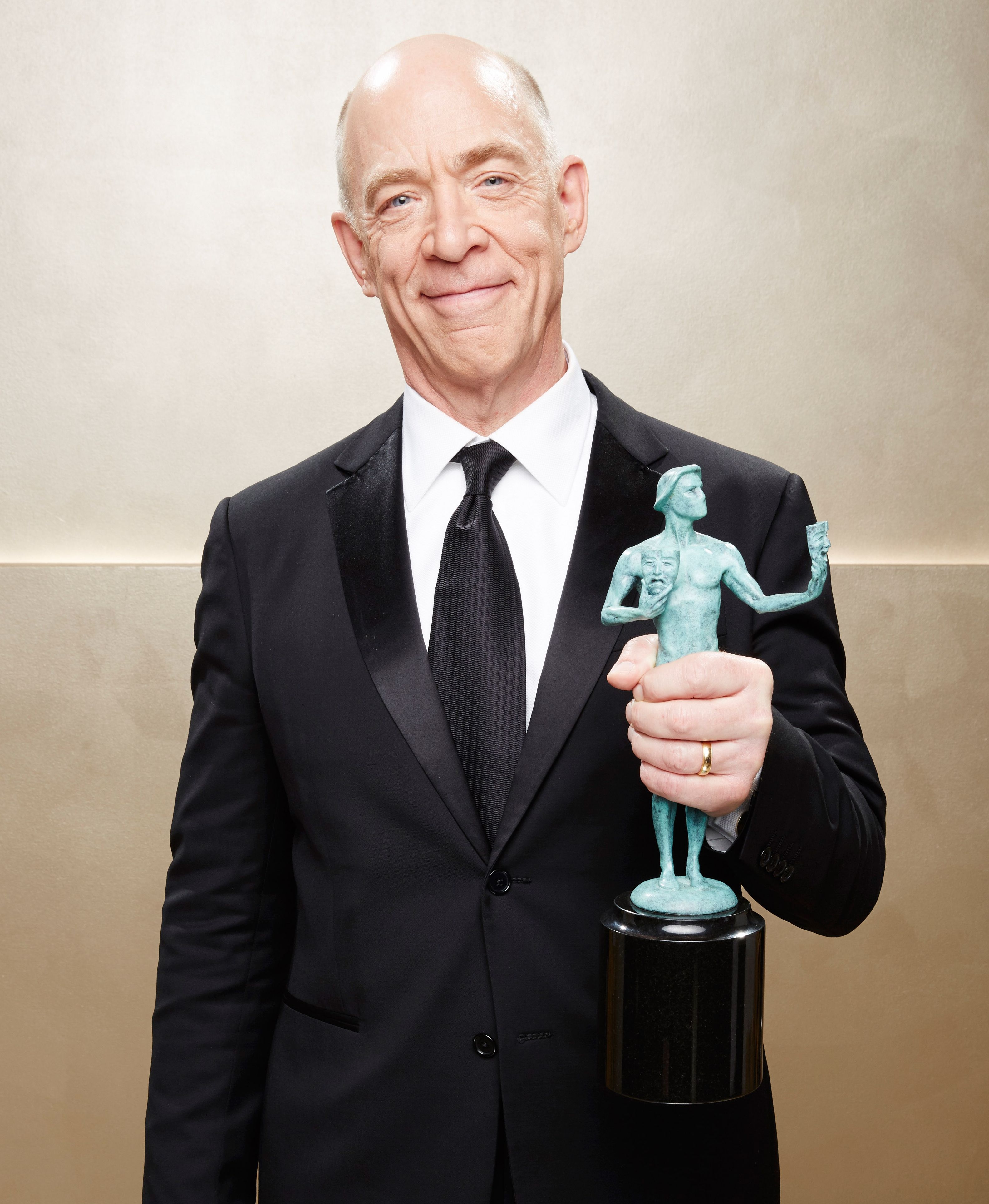 J.K. Simmons holds up his 2015 SAG Award for Whiplash