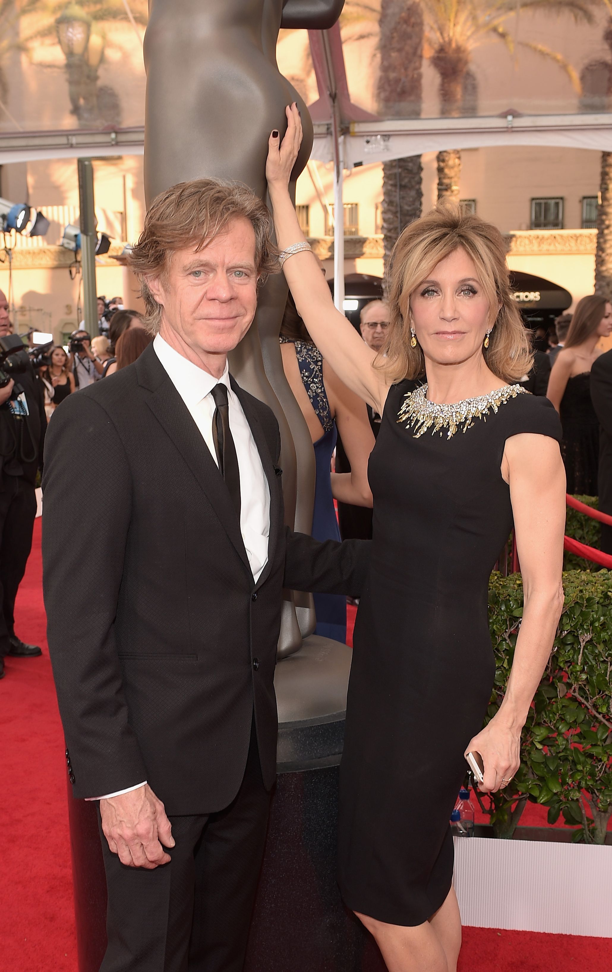 William H. Macy and Felicity Huffman grabbing SAG statue bot