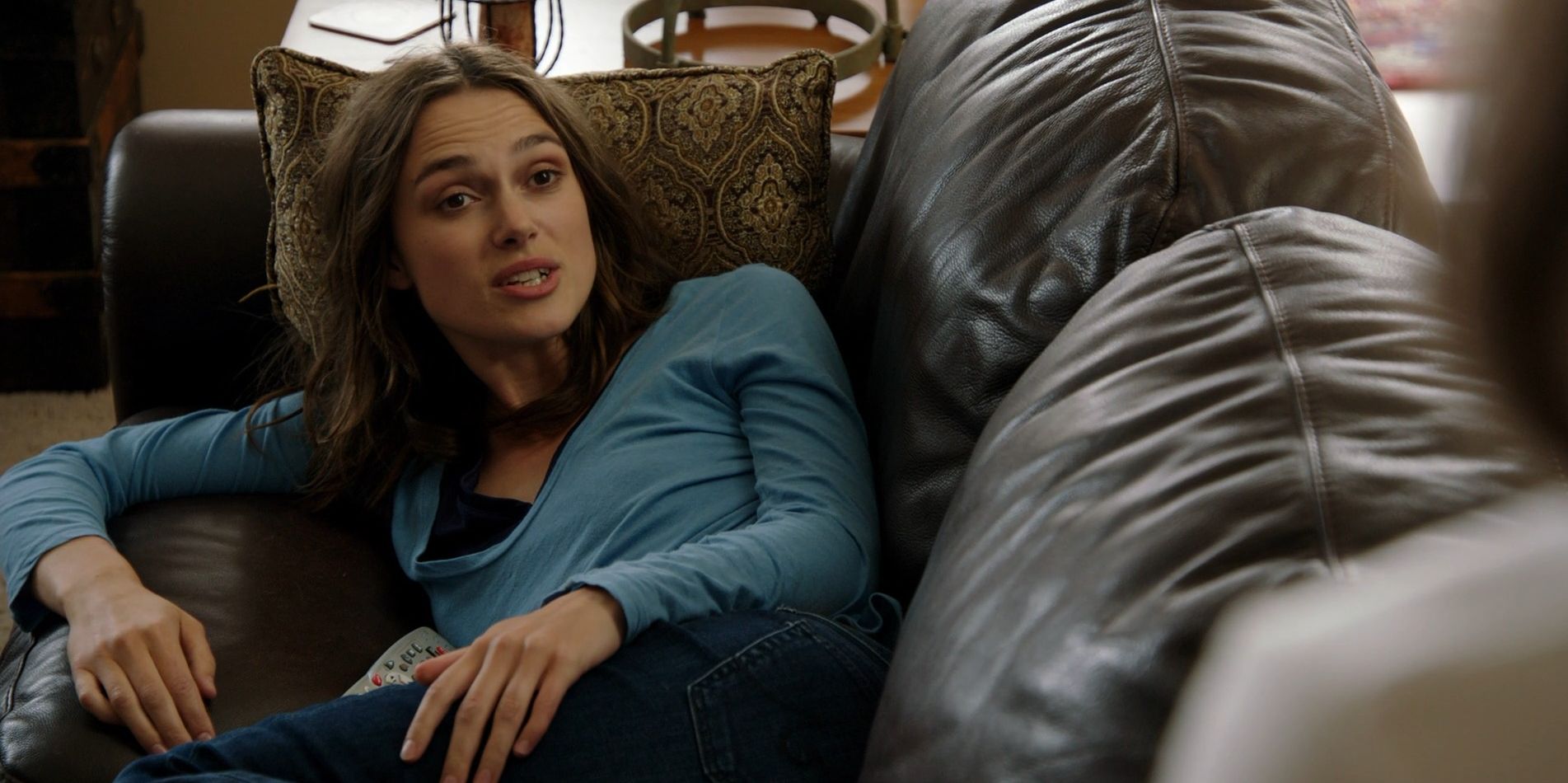 Keira Knightley lays in the couch in Laggies