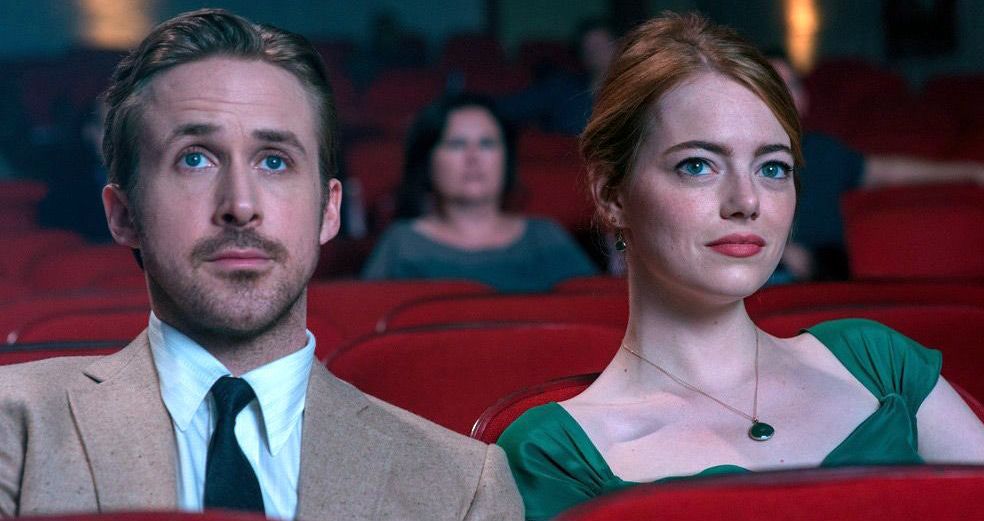 Ryan Gosling and Emma Stone watch a movie in 'La La Land'